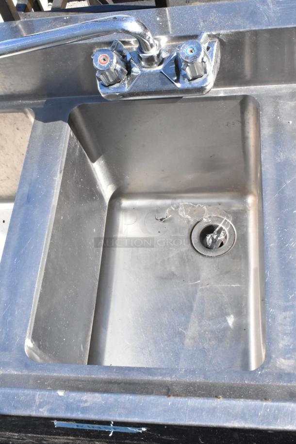 Regency 600B3101413LFT stainless steel 3 bay sink with left side drain board, features dual faucet controls, used condition.