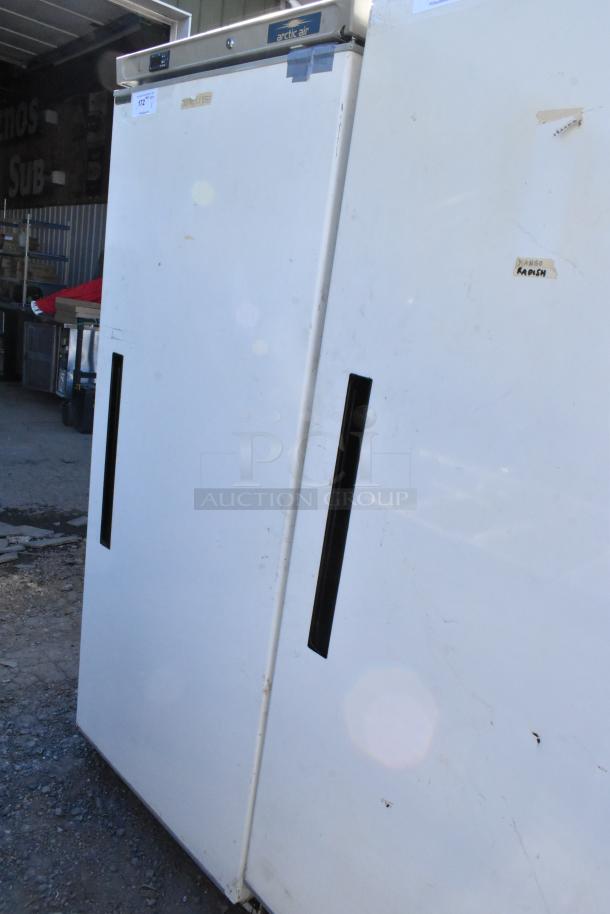 Arctic Air AWR25 single door reach-in cooler, metal, 115 volts, good condition, visible surface wear.