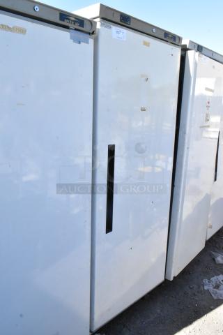 Arctic Air AWR25 metal single door reach-in cooler, 115 volts, 1 phase, visible signs of wear, taped handles, model label on top.