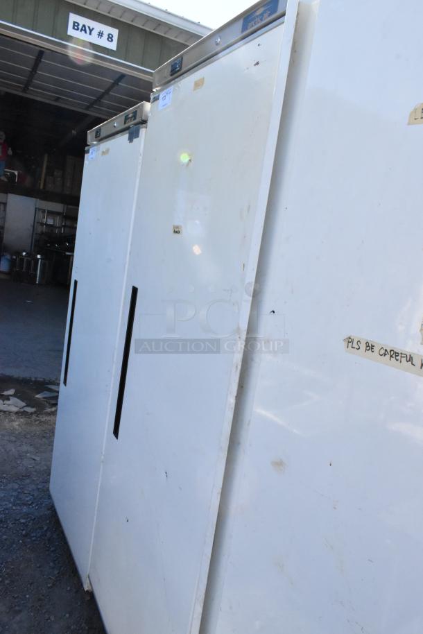 Arctic Air AWR25 metal single door reach-in cooler. 115 volts, 1 phase. Some surface wear visible.