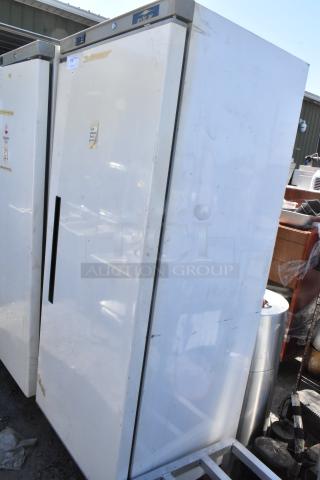 Arctic Air AWR25 metal single door reach-in cooler, shows signs of wear. Model AWR25, 115 volts, 1 phase.