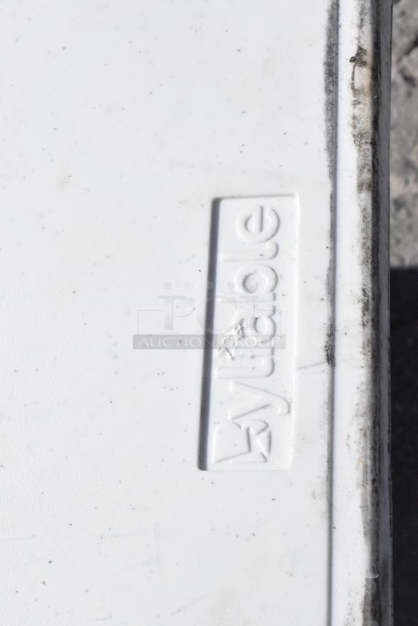 Folding table with "Bytabel" marking, showcasing a white surface with some scuff marks, part of a versatile item set.