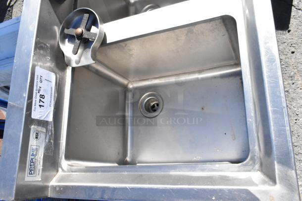 Stainless steel 3 bay sink with glass washer, PrepLine label, good condition with visible minor wear. Auction tag attached.