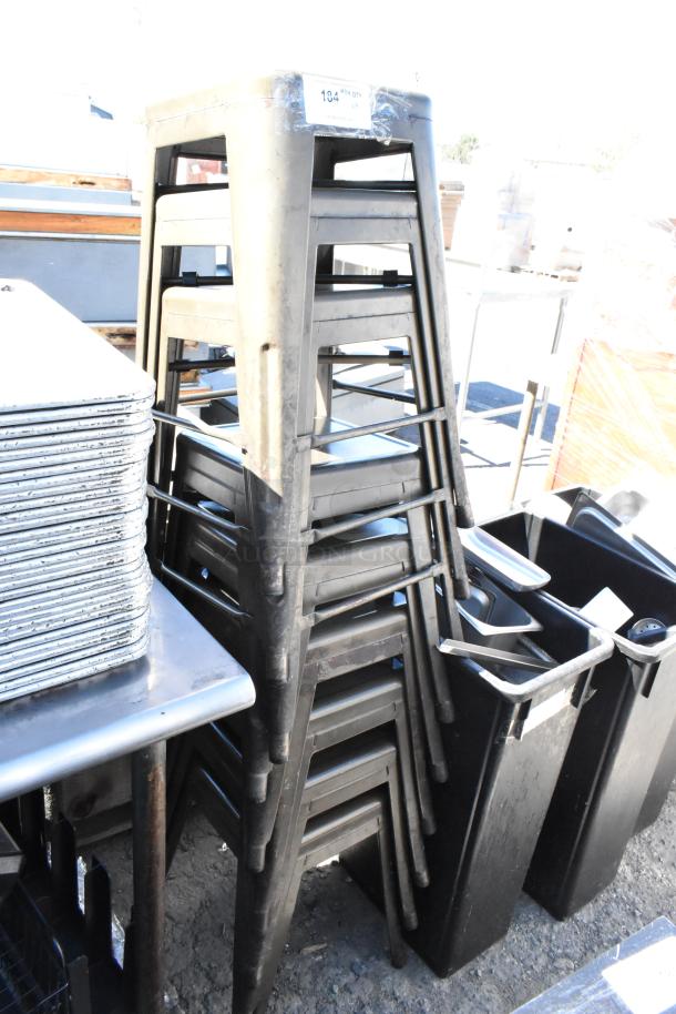 Stack of 9 metal Tolix style bar height stools in good condition, visible label with item number "194".