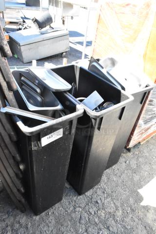 Three black Poly Slim Jim trash cans filled with assorted contents. Lot marked "185" for auction.