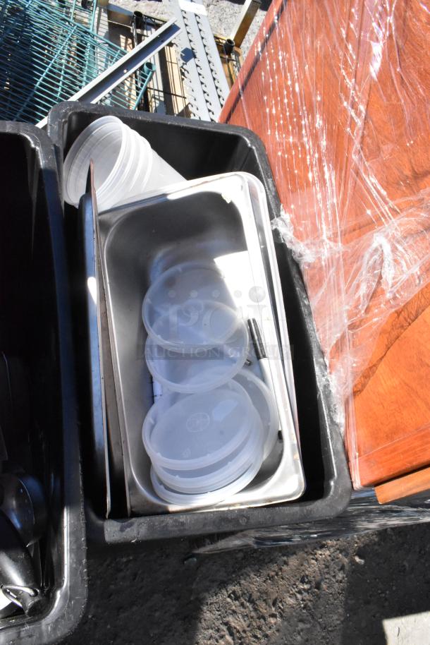 Three Poly Slim Jim trash cans filled with assorted plastic containers and metal items, fair condition.