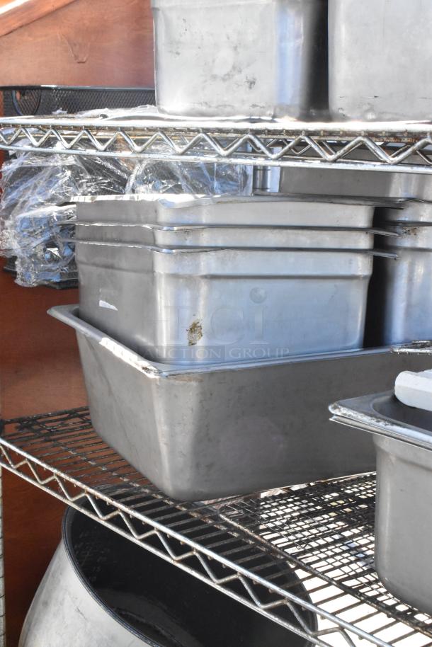 Chrome finish 4-tier wire shelving unit with stainless steel drop-in bins. Buyer must dismantle for shipping.