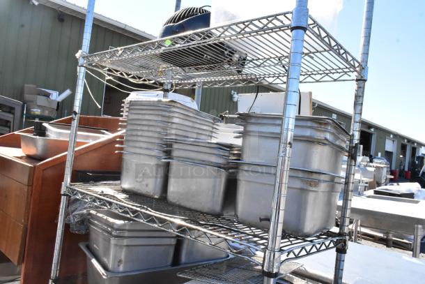 Chrome finish 4-tier wire shelving unit with stainless steel drop-in bins. Buyer must dismantle, freight charges apply.