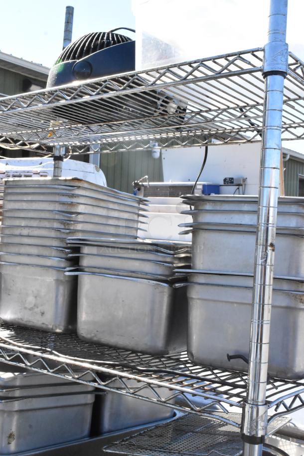 Chrome finish 4-tier wire shelving unit with stainless steel drop-in bins. Buyer must dismantle. Consider freight charges.