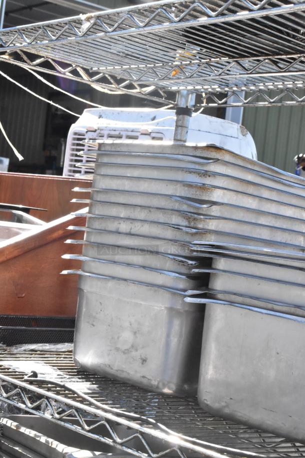 Chrome finish 4-tier wire shelving unit with stainless steel drop-in bins. Requires dismantling; consider freight charges.