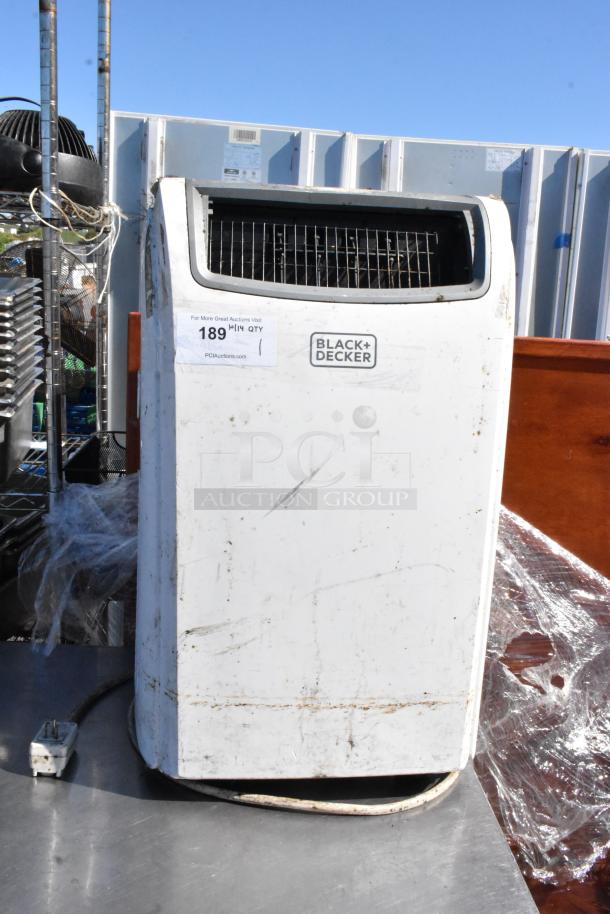 Black & Decker BPACT14H portable air conditioner, visible wear, 115 volts, 1 phase, brand label intact, auction tag attached.