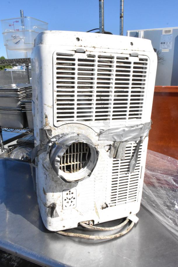 Black & Decker BPACT14H portable air conditioner, damaged condition, visible duct tape repairs on vent area.