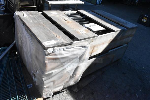Brand new crate with 10 Anthony doors, size 23-1/8"x60". Visible labels indicate item details and quantity.