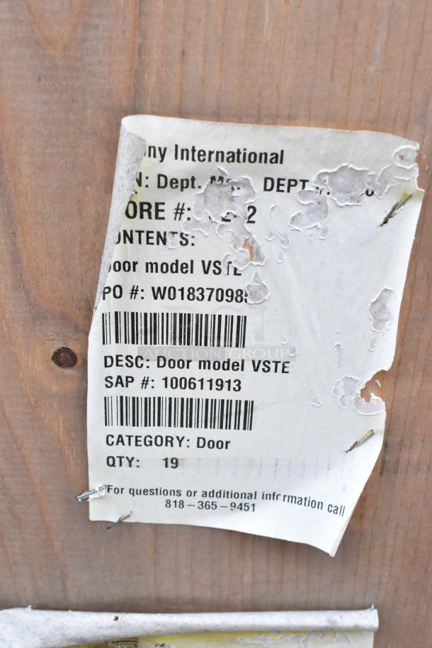 Label on wooden crate for Anthony doors, model VSTE, 23-1/8"x60". Indicates quantity 19, SAP #100611913.