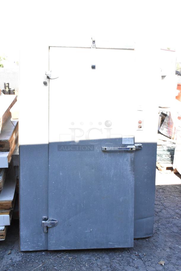 Norlake self-contained walk-in freezer with Norlake CPF060DC-A compressor, 115/208-230V, 1 phase, metal exterior.