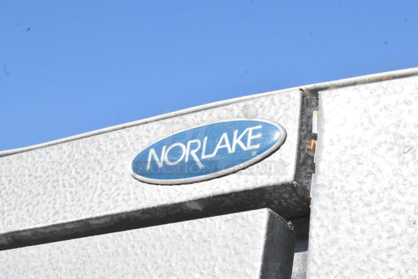 Norlake self-contained walk-in freezer corner with logo, features model CPF060DC-A, 115/208-230V, 1 phase, with compressor.