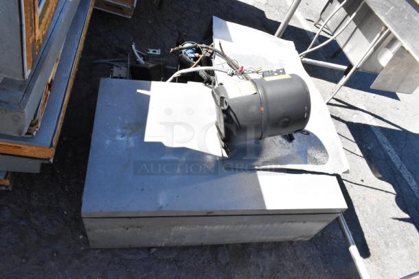 Norlake self-contained walk-in freezer with CPF060DC-A compressor, 115/208-230V, 1 phase. Visible wear on exterior.