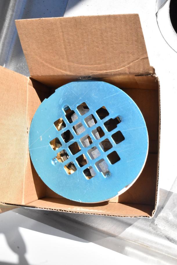 KoolMore MPS-1922123 stainless steel mop sink, brand new with minor dents. Blue drain cover shown in cardboard packaging.