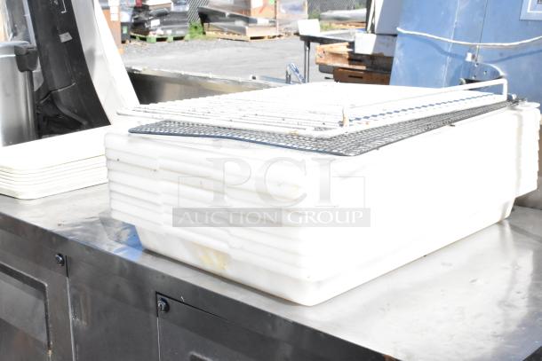 True TBB-3-S Stainless Steel 2 Door Undercounter Cooler, commercial-grade, 115V, with storage contents visible.