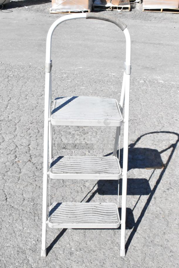 3-step metal ladder; white, with textured steps; used condition.