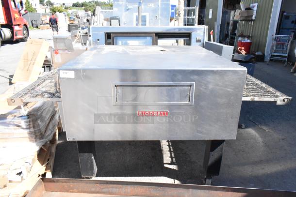 Blodgett stainless steel commercial conveyor pizza oven on casters, electric, 208-240 volts, 3 phase, logo on front.