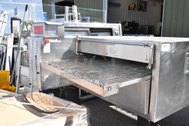 Blodgett stainless steel commercial electric conveyor pizza oven, on casters, 208-240V, 3 phase, used condition.