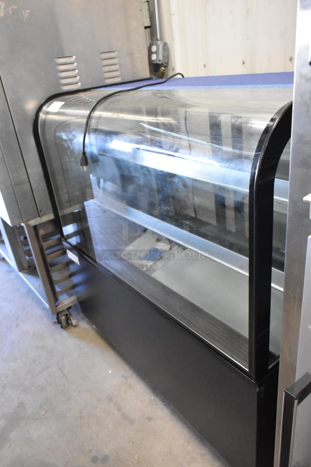 Avantco 193BCD48B dry display case merchandiser in black metal, floor style, 115V, 1-phase. Clear curved glass front.