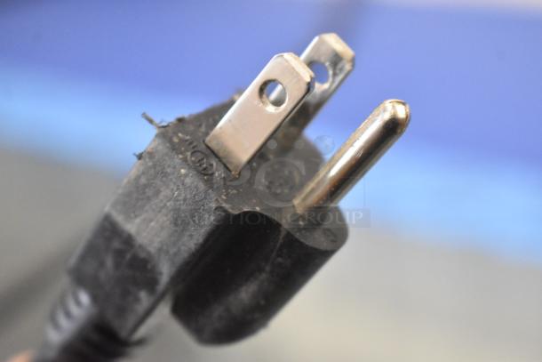 Close-up of an electrical plug for an Avantco 193BCD48B commercial dry display case, showing plug details and condition.
