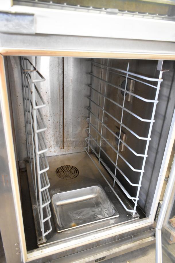 SuperSystems OP-3 stainless steel electric oven proofer, 120/208V, 3 phase, with interior racks and drip tray, shows wear.