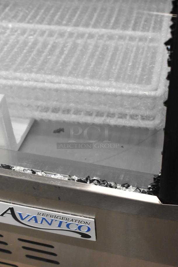 Avantco stainless steel deli display case, broken glass visible, "Refrigeration" label. Scratch and dent condition.