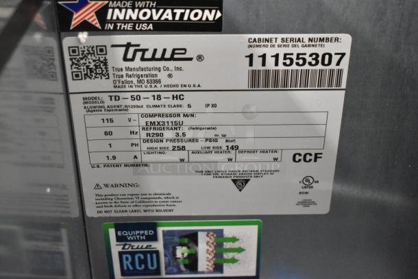Brand new True TD-50-18-HC back bar cooler label, model details, voltage, refrigerant info, and serial number visible.
