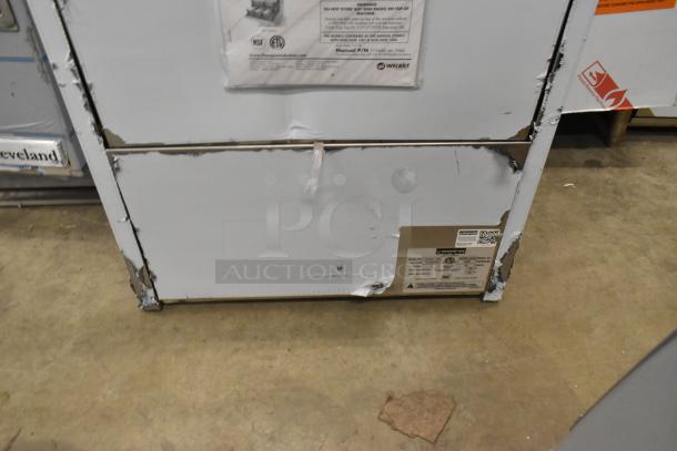 Brand new 2025 Champion UH130B-70 stainless steel undercounter dishwasher, high-temp, 208/240V, minor dents visible.