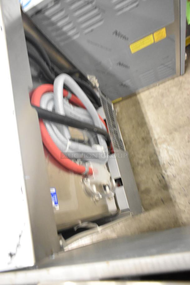 Brand new 2025 Champion UH130B-70 stainless steel undercounter dishwasher, high temp, 208/240V, 1 phase, visible hoses.