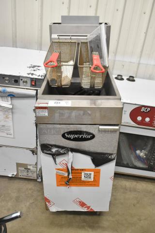 Brand new Superior LG300-6 stainless steel propane deep fat fryer, 90,000 BTU, with 2 metal fry baskets, minor dents visible.