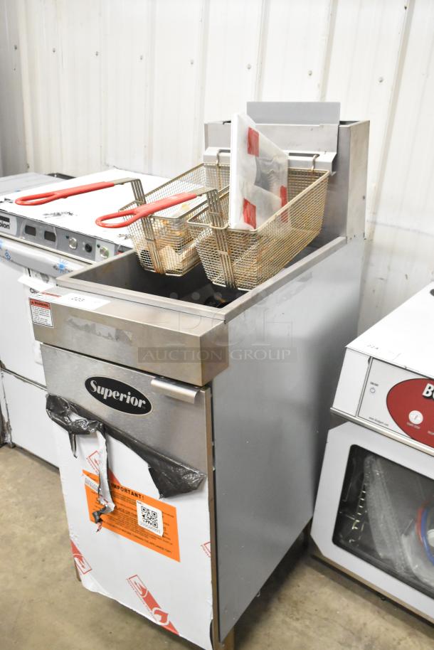 Brand new Superior LG300-6 stainless steel propane gas fryer with 2 metal baskets. 90,000 BTU, minor scratches visible.
