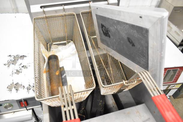 BRAND NEW SCRATCH AND DENT! Superior LG300-6 stainless steel commercial propane gas fryer with 2 metal baskets, 90,000 BTU.