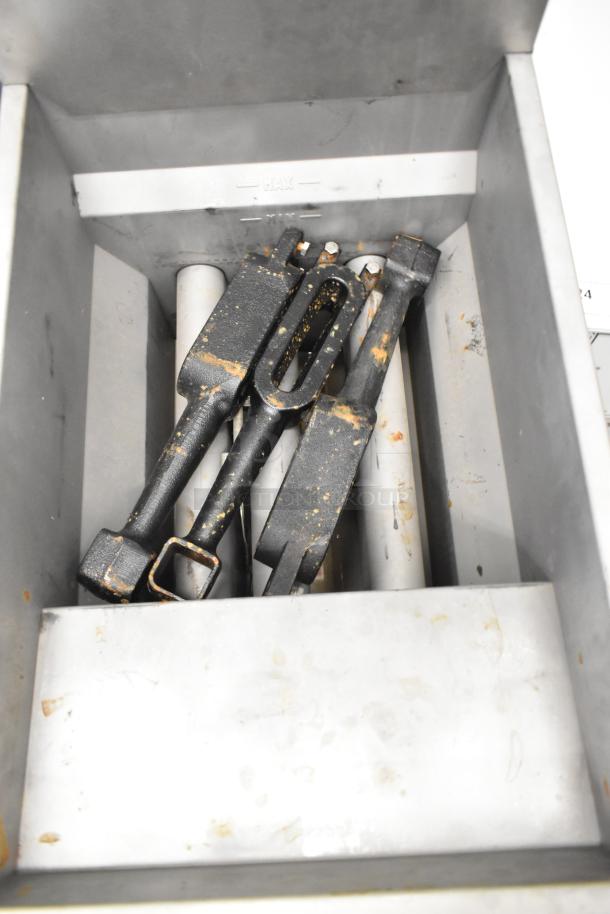Stainless steel interior of Superior LG300-6 fryer showing components; some wear visible, brand new unit with scratches and dents.