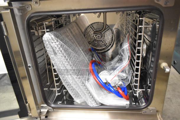 Brand new Blodgett BLCP23E stainless steel combi convection oven interior, 208/230-240V, 3-phase, accessories included.