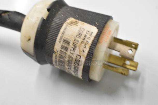 Fetco CBS-51H15 coffee machine power plug with visible wear and labeling for 120/208-240 volts, 1 phase.