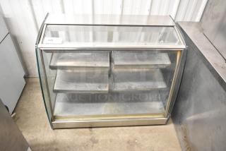 Metal commercial countertop display case with a glass front, featuring multiple shelves. Item tag reads "226". Good condition.
