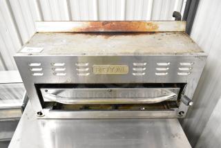 Royal Stainless Steel Commercial Gas Cheese Melter, used condition, sturdy construction, ideal for restaurants, with visible "Royal" branding.