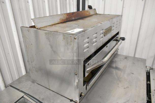 Royal Stainless Steel Commercial Gas Powered Cheese Melter, used condition, visible wear and rust on top surface, model tag intact.