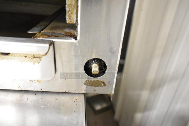 Royal Stainless Steel Commercial Gas Cheese Melter, features visible wear, durable build, ideal for heavy kitchen use.