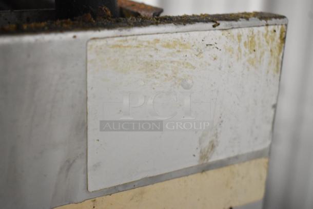 Royal stainless steel commercial gas cheese melter with visible wear. No visible labels or markings.