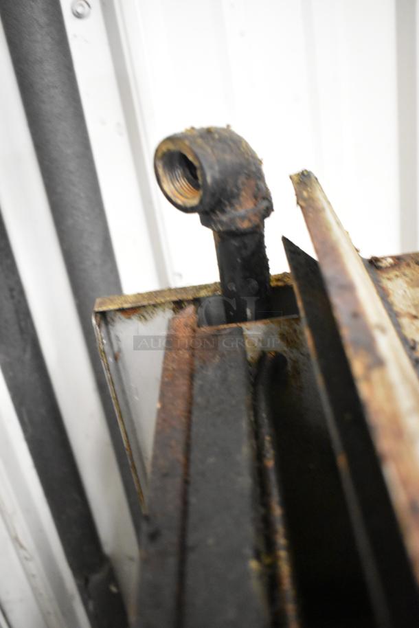 Royal Stainless Steel Gas Cheese Melter, commercial grade. Notable rust and wear visible on the pipe connection.