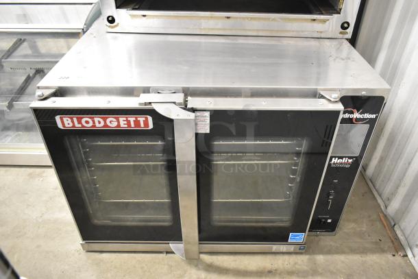 Blodgett Helix stainless steel full-size convection oven with view-through doors and metal racks, excellent condition.