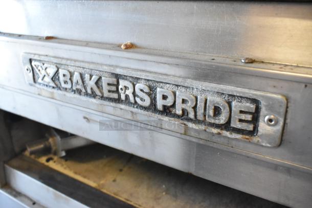 Bakers Pride EP-2-2828 stainless steel 2-deck pizza oven, electric, on commercial casters, 208V, worn condition logo plate visible.