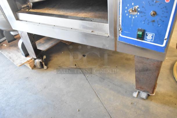 Bakers Pride EP-2-2828 Super Deck pizza oven, stainless steel, dual deck, on commercial casters, 208V, 1 phase, used.