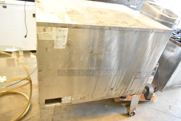 Bakers Pride EP-2-2828 stainless steel 2-deck pizza oven on commercial casters, used condition, 208V, 1 phase, visible labels.