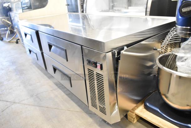 Brand new Avantco 178CBE72HC chef base with four stainless steel drawers, commercial casters, and minor dents.